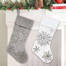 Set of two Christmas stockings, gray and white, with large snowflake appliques