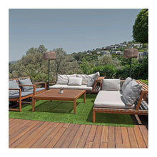 Artificial grass rug with short green pile on outdoor patio