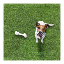 Artificial grass lawn surface with short green blades