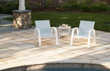 White outdoor sling seating set with two chairs and small table, deep seating