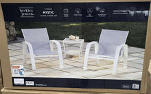 Three-piece outdoor sling chair and table set in white, shown in retail box