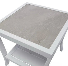 Outdoor side table with light gray tabletop and white frame