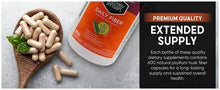 Daily fiber supplement capsules spilling from a bottle with orange label