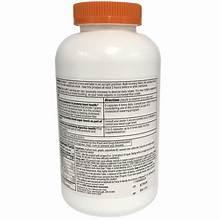 Daily fiber supplement bottle with orange cap and back label nutrition facts