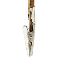 Silver metal clip ornament with fabric-wrapped top and cord loop