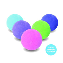 Color-changing bath bombs: five spheres in pink, green, purple, blue, and teal