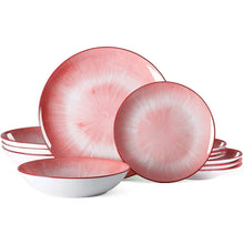 Pink and white dinnerware set with plates and bowls for four
