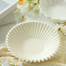 Off-white tabletop decorative bowl with pleated ribbon design and scalloped rim