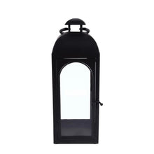 Black metal lantern candle holder with open door and arched glass window panel