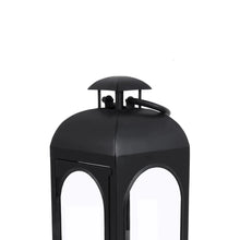 Black metal lantern candle holder with curved top and arched window panels