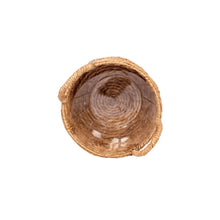 Round bulrush basket planter top view, tightly woven tan straw
