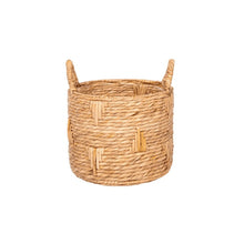 Round woven bulrush basket planter with two side handles, tan straw weave