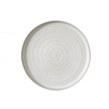 Cream stoneware dinner plate with concentric spiral pattern on round rim