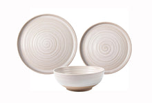 Stoneware dinnerware set with swirl pattern plates and a matching bowl