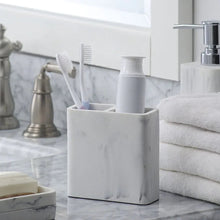White faux marble toothbrush holder with two slots for toothbrushes