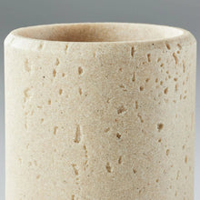 Speckled beige faux stone toothbrush holder close-up of open cylinder rim