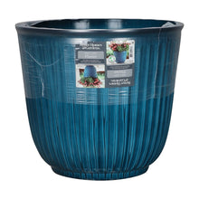 Light blue ribbed resin planter with product label on the front, round open top