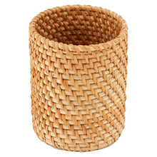 Natural rattan toothbrush holder with woven cylindrical design and open top