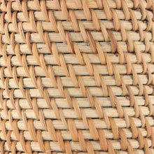 Close-up of woven natural rattan texture on a toothbrush holder