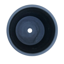 Round ceramic planter bottom with central drain hole in dark blue-gray glaze