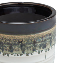 Round ceramic plant planter with dark rim and speckled gold-green drip glaze