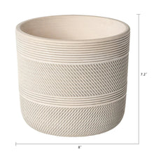 Round white ceramic planter with textured exterior, shown with height and width labels