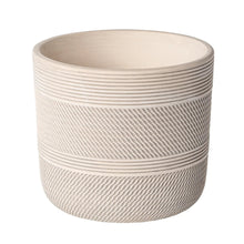 Round white ceramic planter with ribbed texture