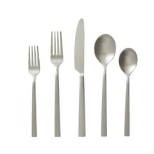 Satin stainless steel flatware set pieces with ribbed handles, five utensils shown