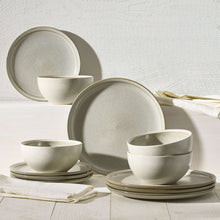 Cream stoneware dinnerware set: plates and bowls in a matching muted beige