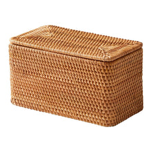Brown rattan organizer basket with closed lid, rounded corners and woven texture.