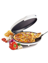 Electric pizza oven with open lid and nonstick cooking plate, holding a pizza