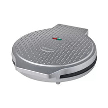 Countertop pizza oven with textured lid, silver body and closed hinged top