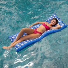 Starfish-pattern pool float, blue-and-white inflatable lounge floating in water
