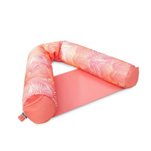Pink palm-pattern sling pool float with cushioned neck support and side arm bolsters