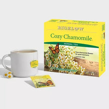 Chamomile herbal tea box with tea bag sachet and white mug
