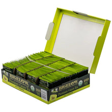 Open premium green tea box showing rows of individually wrapped tea bags