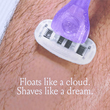 Razor with 5-blade refill cartridge, with purple gel applied over skin
