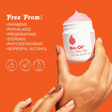 Dry Skin Gel jar held in hand, white container with gray lid