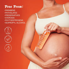 Pregnant woman applying Bio-Oil skincare oil to her belly
