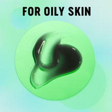 Thick dark charcoal face wash gel smear, glossy texture.
