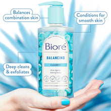 Balancing cleanser bottle with light blue pump, held in a hand