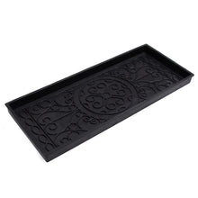 Black rubber boot tray with embossed oval medallion and scrolling pattern