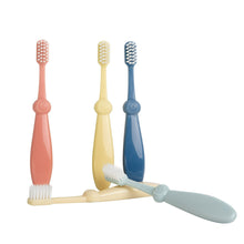 Infant training toothbrush set with 3 soft-bristle brushes: coral, yellow, and blue handles