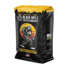 Ground coffee bag, black with gold top; Tactisquatch character and U.S. flag patch.