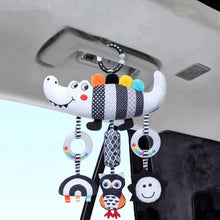 Baby hanging sensory rattle with striped crocodile plush and two round rattle rings attached