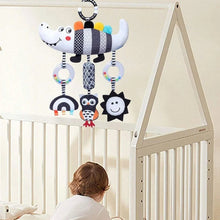 Baby hanging sensory rattle featuring striped crocodile plush with dangling ring toys