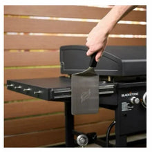 Open hood griddle with side panel and mounted accessory shelf near tool hooks