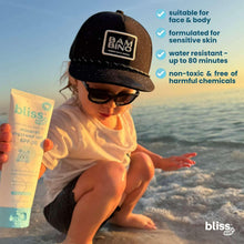 Baby mineral sunscreen lotion tube SPF 50, held by child