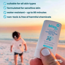 Mineral sunscreen stick with round cap tip held for application, SPF 50