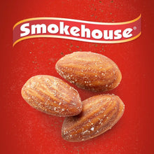 Smokehouse almonds close-up: three brown sugar-coated almond pieces on red branding